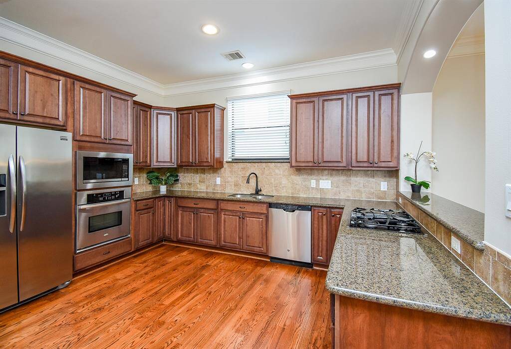 Chef's kitchen is intimate yet spacious with SS appliances.