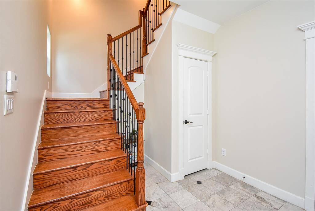 Beautiful hardwood staircase entry.