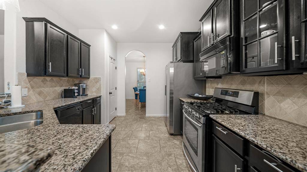 In this open concept design, the kitchen serves as the heart of the home, where meals are prepared, conversations flow, and memories are made.