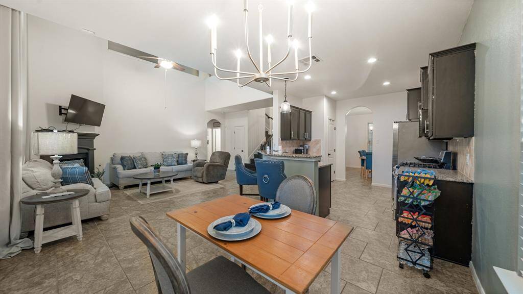 Overall, the open feel of the home encourages interaction and engagement, making it a welcoming and inviting place for family and friends to gather and enjoy each other's company.