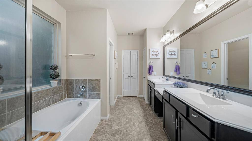Unwind in your deep soaking tub or jump in the separate shower for a quick rinse.