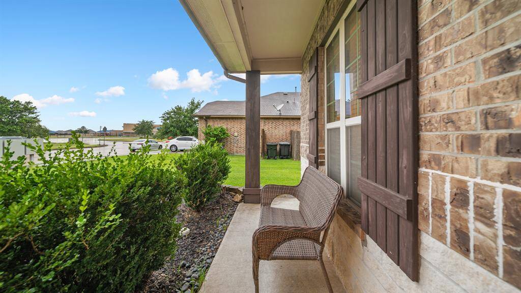 This home features impeccable curb appeal with a beautiful brick and stone exterior elevation. Great front porch to sit back and relax.