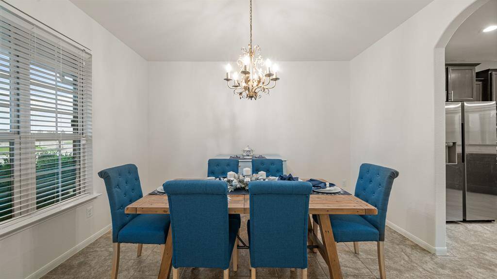 To the left of the entry if your formal dining area. This is a perfect space for those special gatherings.