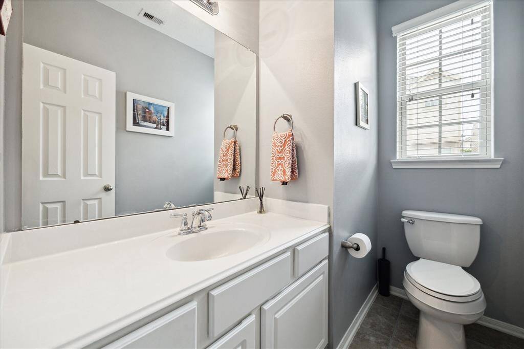 Powder bath tucked away for privacy.