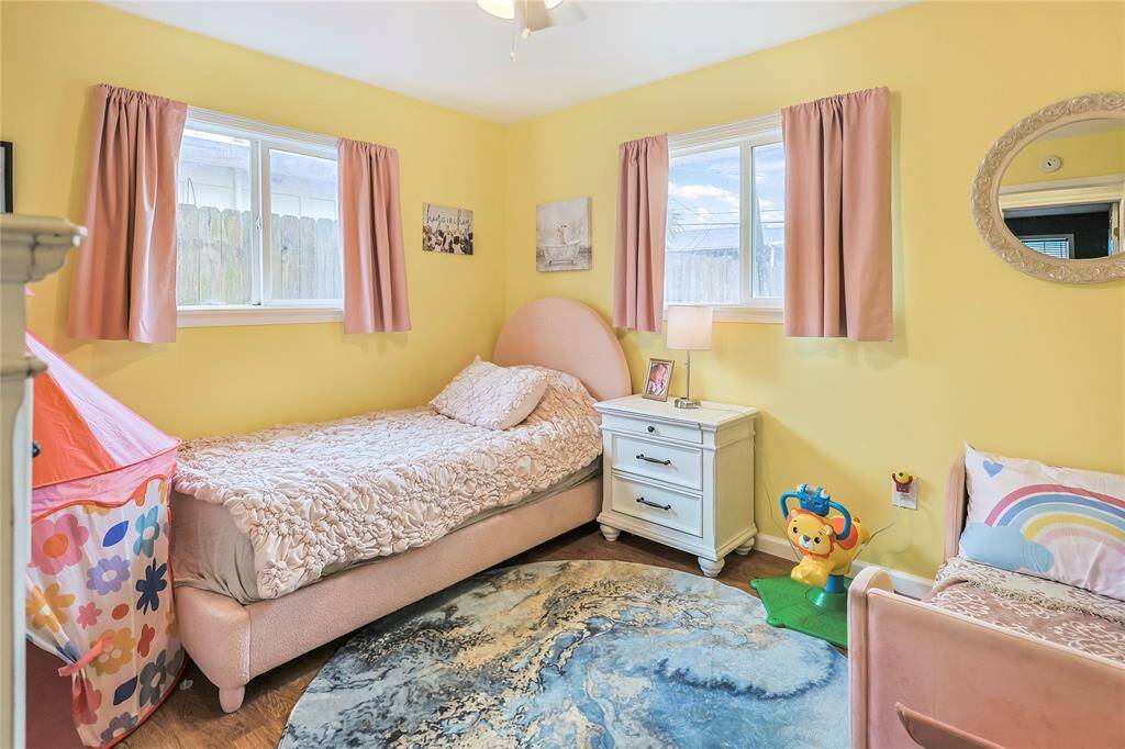 A third bedroom continues the trend of ample windows and natural light.  Such a cute room for the kiddos.