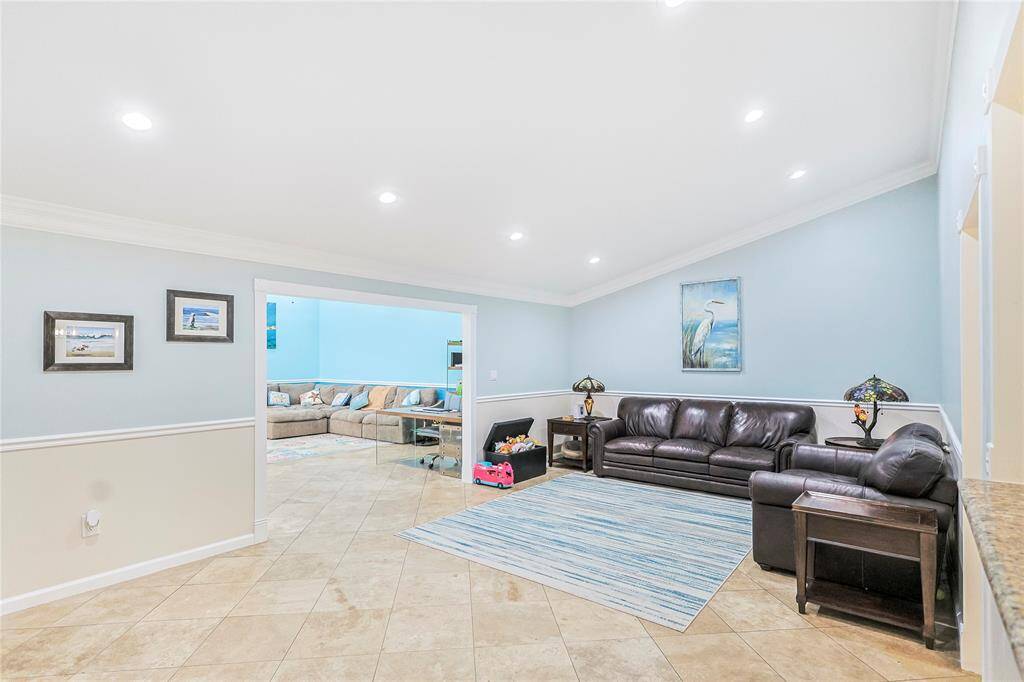 This home features two amazing living rooms with incredible vaulted ceilings with recessed lighting for a refined aesthetic and premier functionality.  New paint throughout keeps the space light and bright.