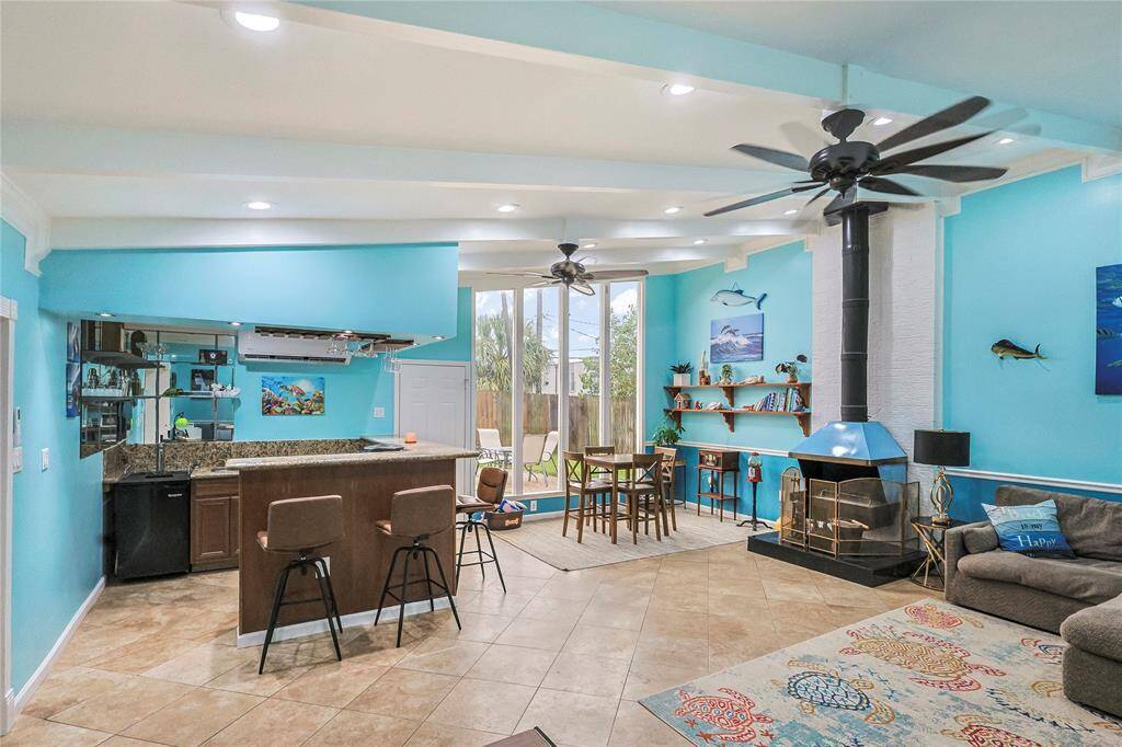 This newly updated home has room for all with two large living areas! Relax in the expansive second living area that features large windows, a pipe chimney fireplace and a designated wet bar- perfect for entertaining or enjoying a quiet evening.  Yes that is a Kegerator!!