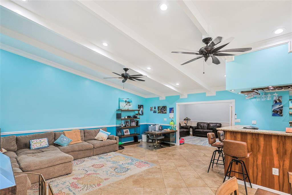 Another view of both living areas.  New paint, beautiful flooring, vaulted ceilings, light and bright and of course the wet bar with the kegerator!