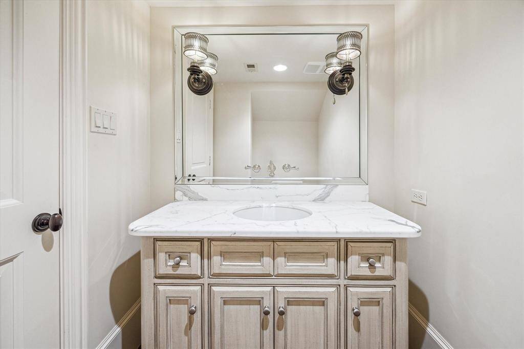 This lovely powder is conveniently located in the main hallway for your guests.