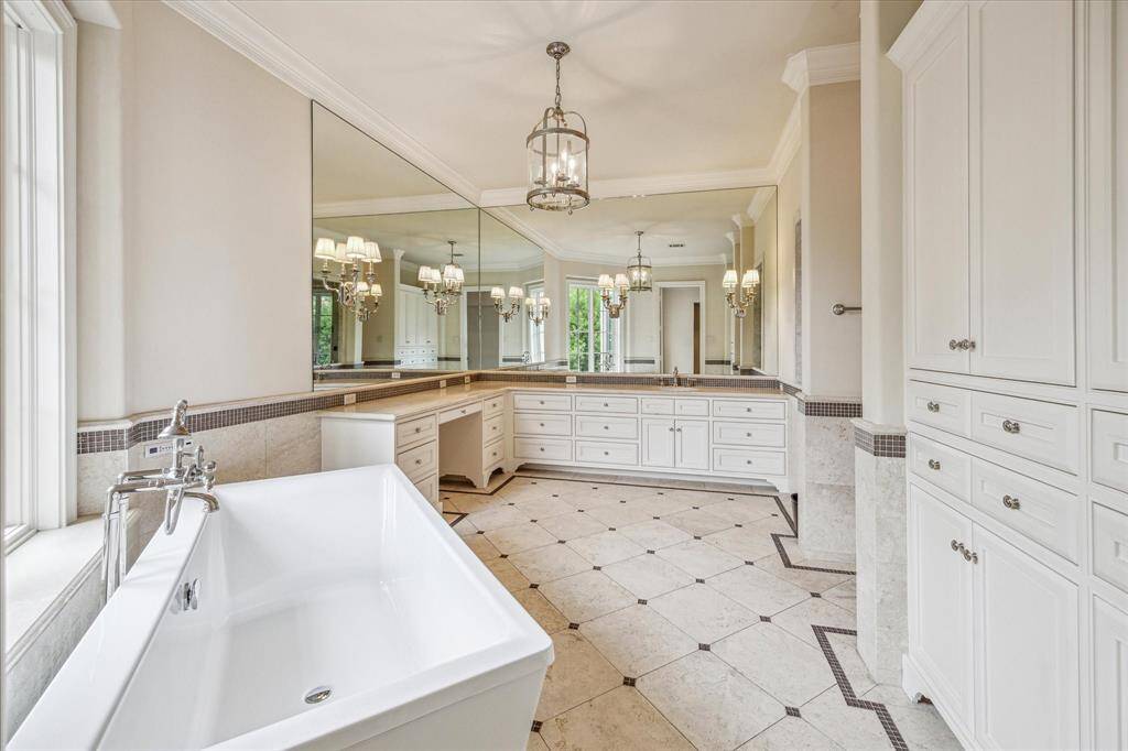 This primary bath is a zen retreat with a soaking tub, large shower and giant closet.