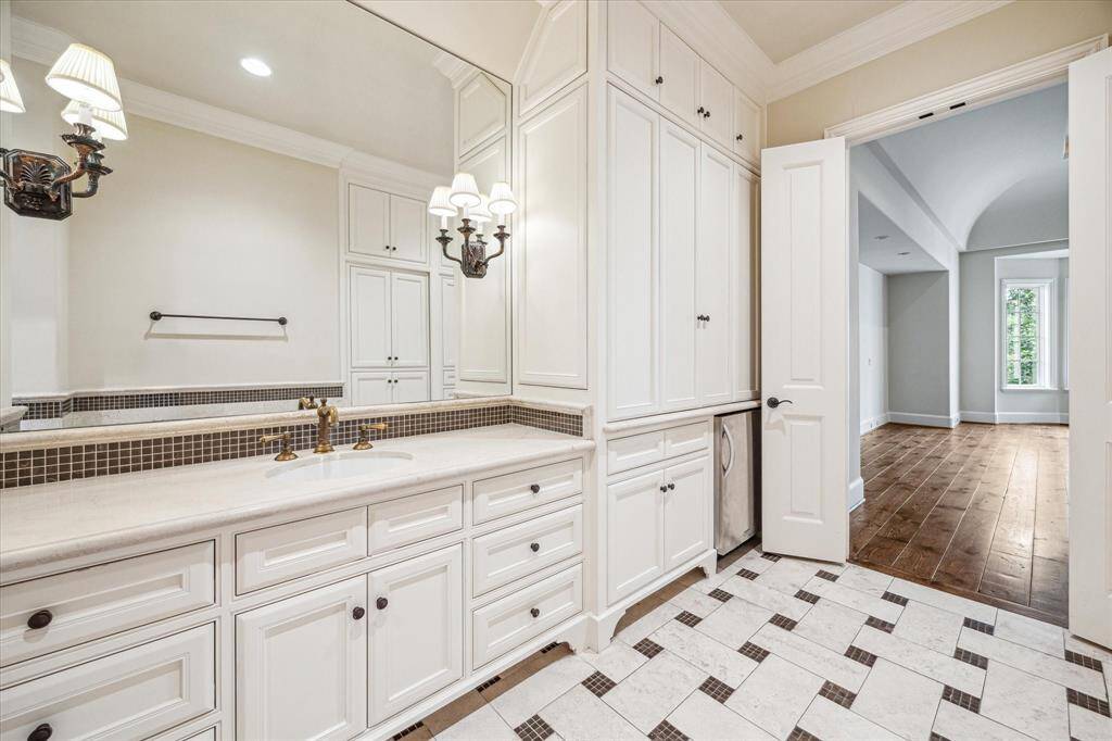 On the other side of the bedroom is another well appointed bathroom and closet, as well as a hidden safe room.