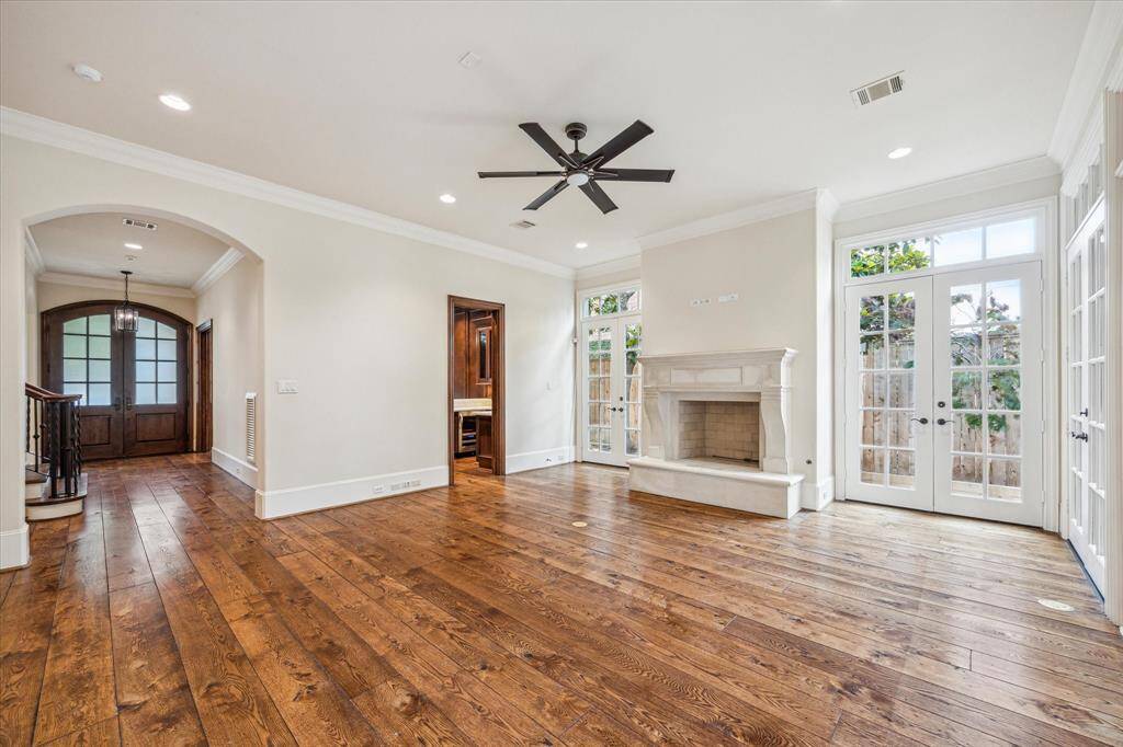 The family room is the heart of the home and opens to a lovely covered patio with an outdoor kitchen.