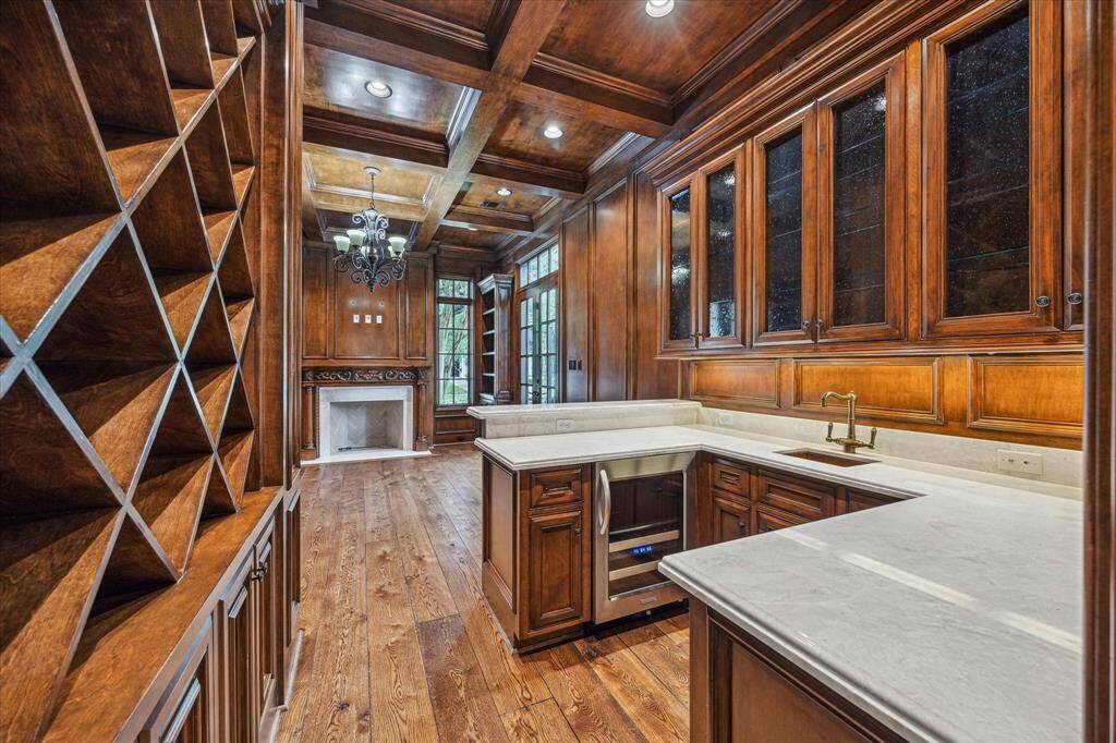 Another view of the immaculate bar with wine storage.