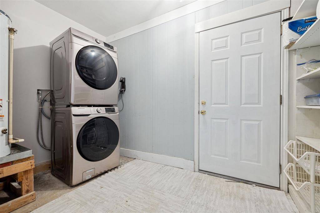 Indoor utility room located off of the bonus room . The door ahead opens into attached garage
