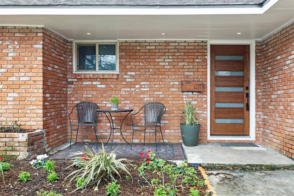 welcoming front porch with modern front door recently added