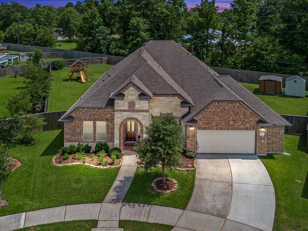Charming 1-story home featuring a classic brick & stone exterior with impressive curb appeal.