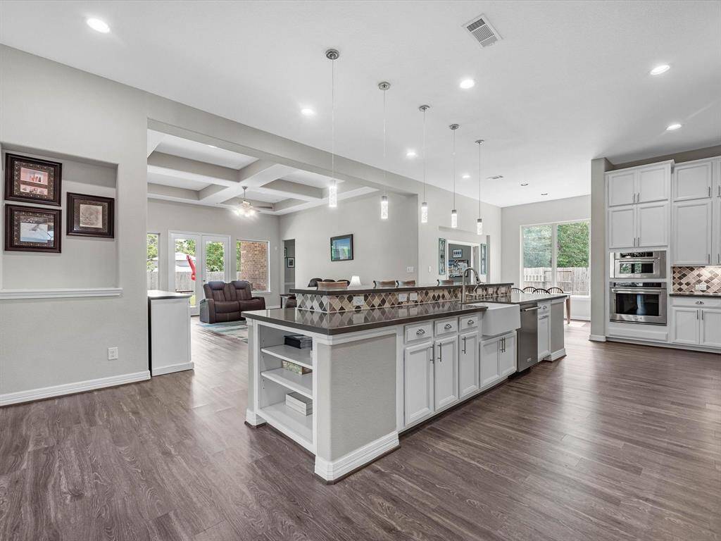 This kitchen island/bar anchors this expansive living area!