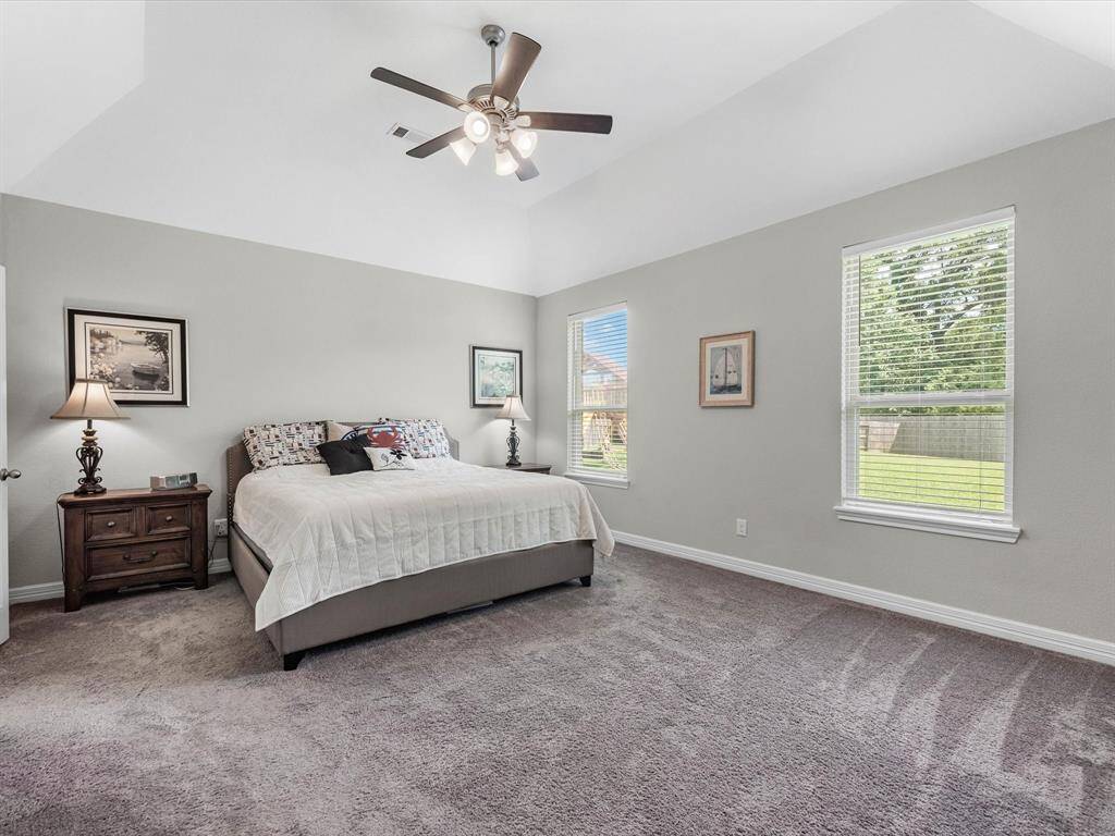 The primary bedroom is generously sized, creating a tranquil and spacious retreat that offers ample room for relaxation.