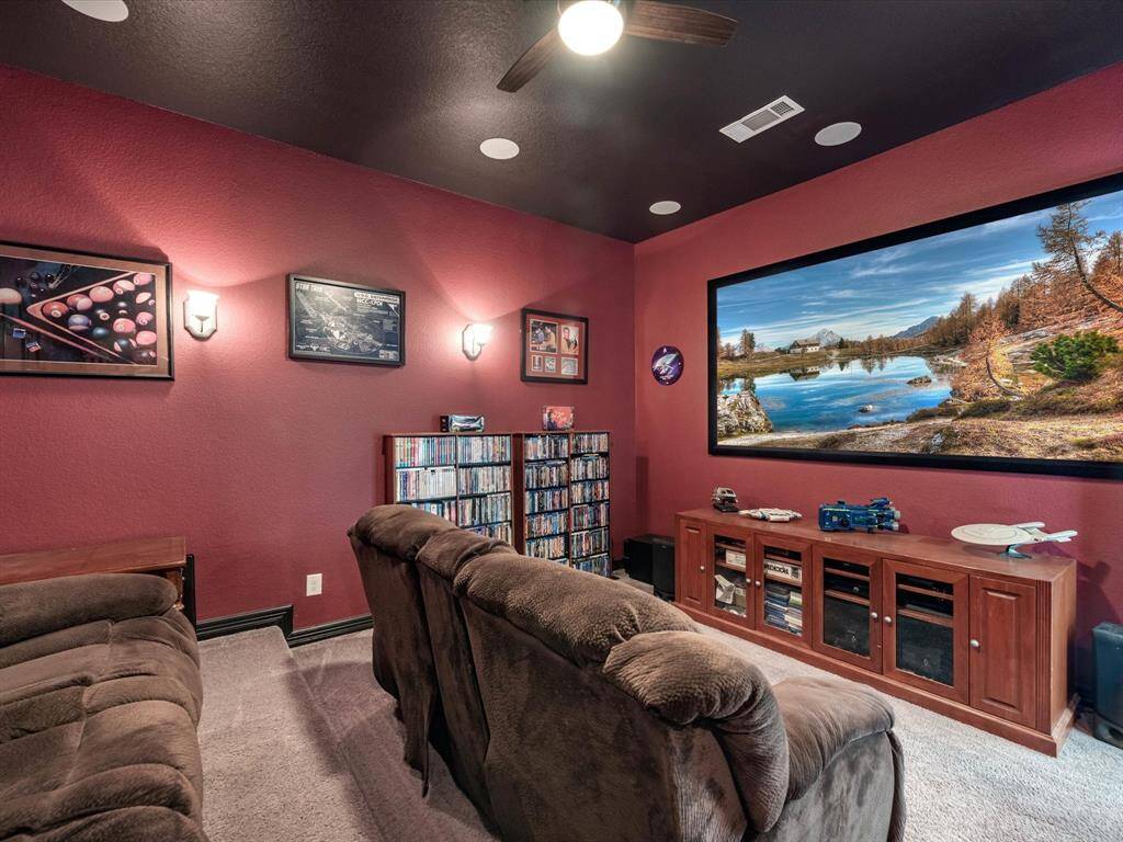 Whether it's family movie night, cheering on your favorite sports team, or hosting a gaming marathon, this media room caters to every form of entertainment.