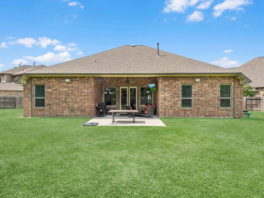This backyard is perfect for family gatherings, social events, or simply unwinding in the fresh air.