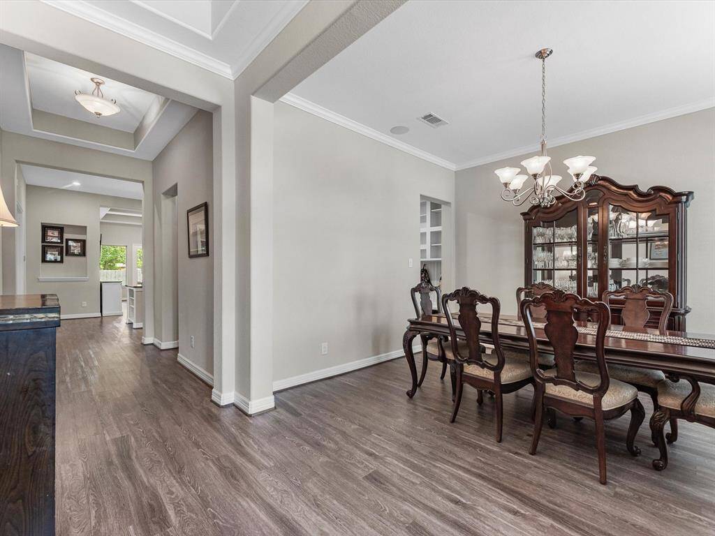 The dining area is a perfect blend of style and functionality, providing an inviting space for memorable meals and gatherings.