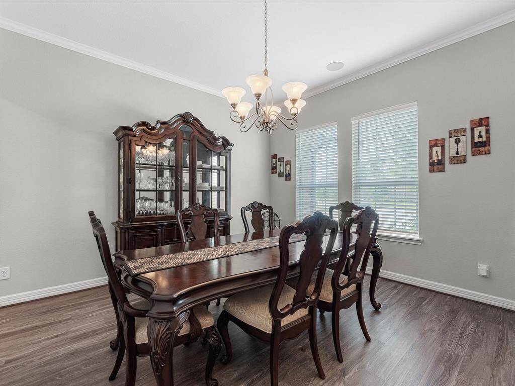An additional view of your dining room, featuring large windows that fill the space with natural lighting.
