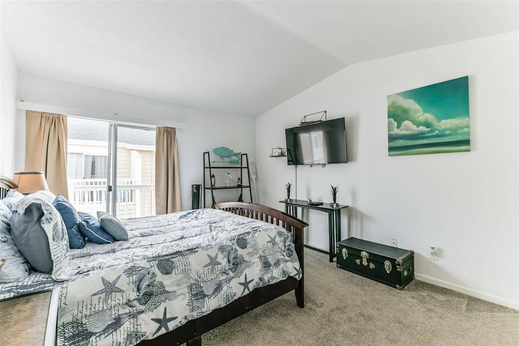 The primary bedroom has its own balcony that faces West.