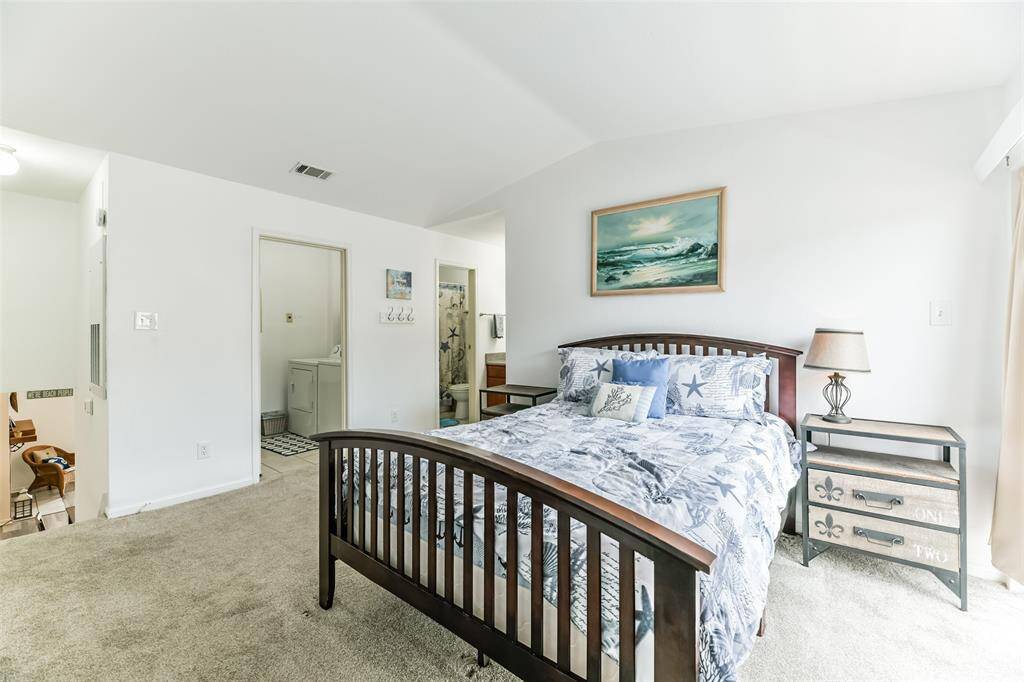 Full bathroom and personal laundry room reside in the primary bedroom.