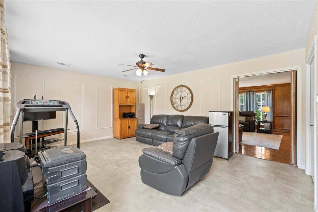 Gameroom Down offers Tile Flooring + Windows overlooking Pool