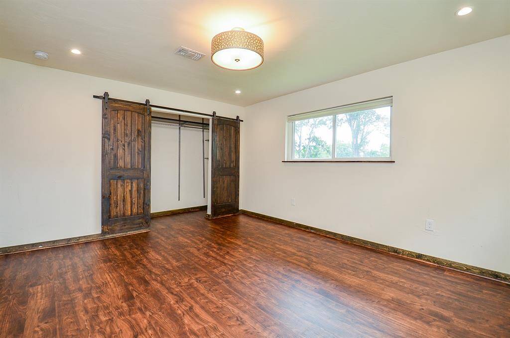 Bedroom 2 offers good size closet with sliding wood doors