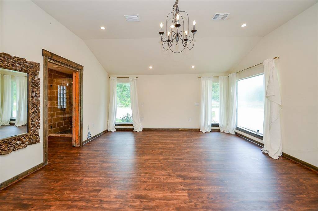 Large primary bedroom, floor to ceiling windows, large primary bath and huge walk in closet