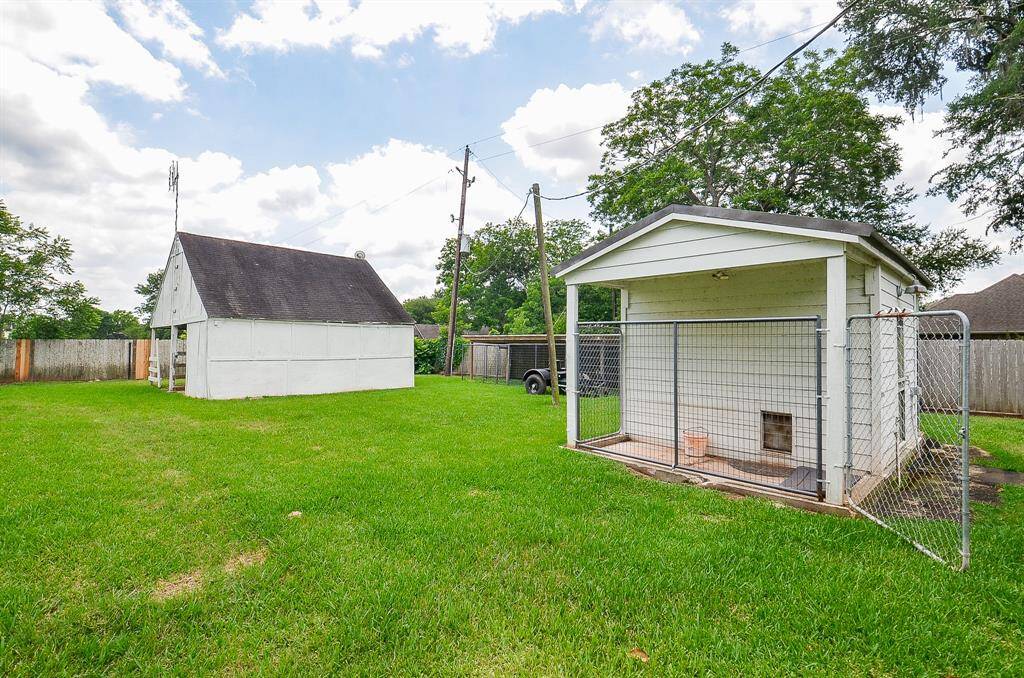 Backyard has a barn, kennels/pens and a small spray foam insulated building on a slab. Perfect for chickens, 4H or hobby farm projects. Horses are allowed.