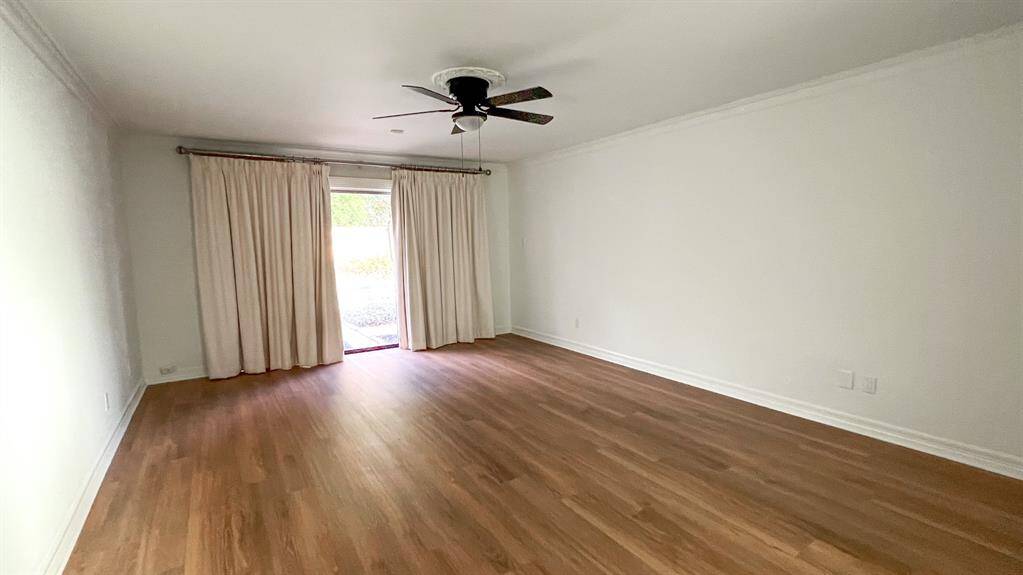 Retreat to the private primary bedroom, featuring access to the lush backyard. Boasting an ensuite bathroom, ensuring the ultimate relaxation and comfort.
