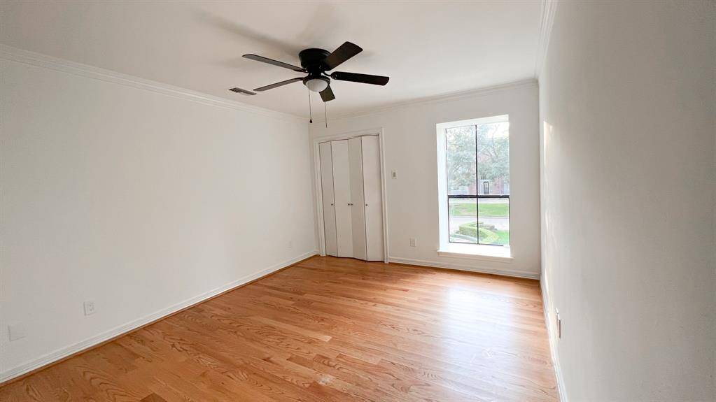The remaining upstairs secondary bedroom offers a thoughtfully placed window to allow natural light while preserving privacy, and closet space, ensuring both functionality and style.