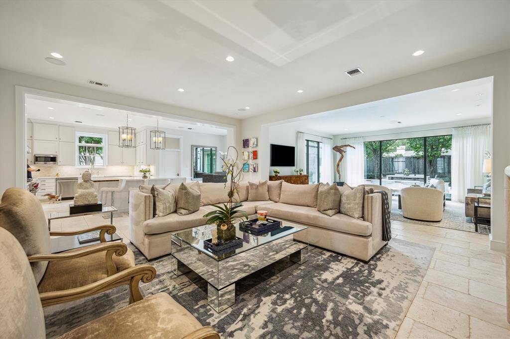 Another view of the Family Room showing its close proximity to the Kitchen and Sunroom - what an accommodating floor plan to allow for an easy flow of space between the rooms!