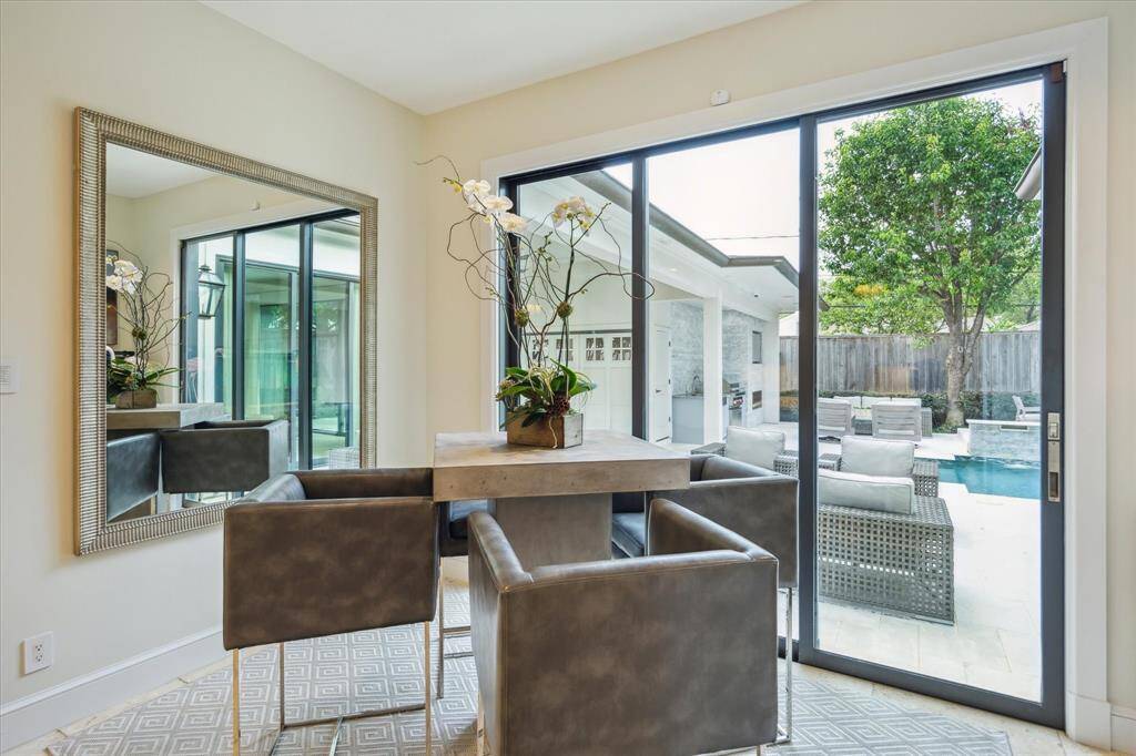 Adjacent to the Kitchen is the BREAKFAST ROOM (13 X 6) with its travertine tile flooring, ceiling speaker, recessed lighting, base molding, 3 panel sliding glass door opening to the Backyard.  A great spot to enjoy a morning coffee or casual meal.