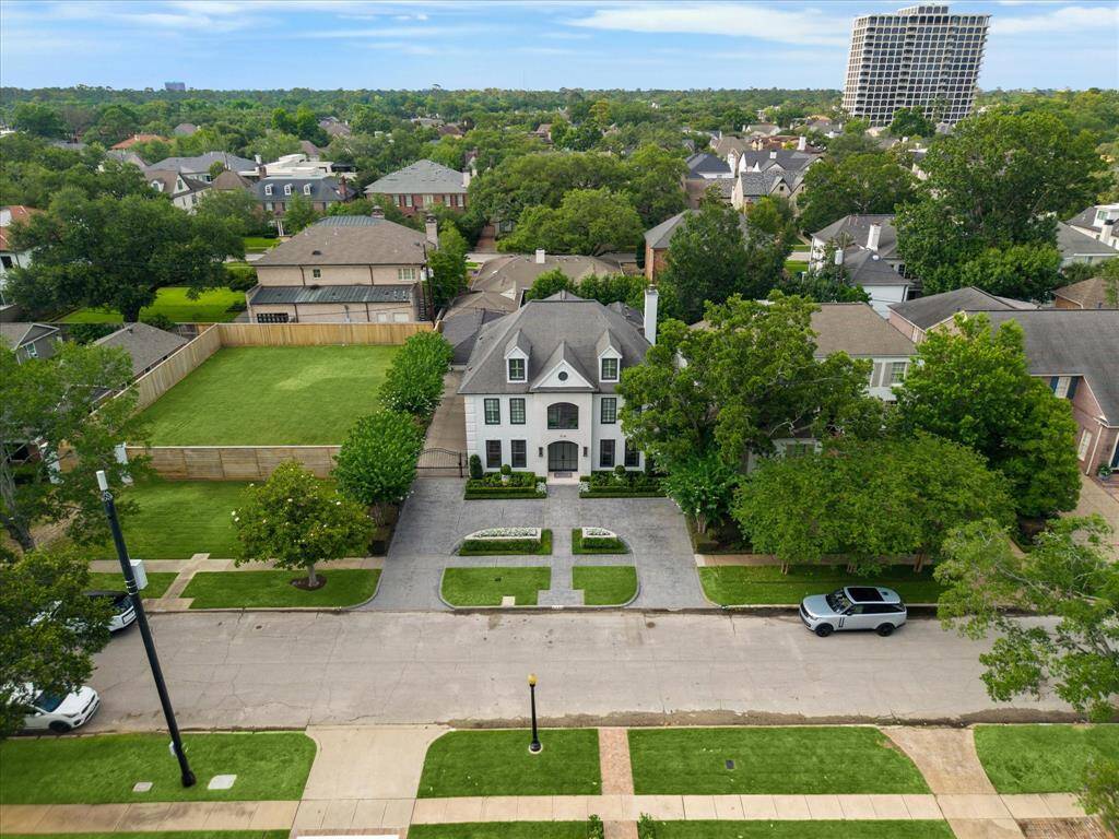 Aerial view of the House and the adjacent grassed lot within the section of Royden Oaks along Wickersham.