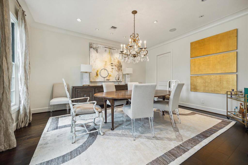 A subtle elegance accents the FRONT STAIRCASE with its painted risers/wood steps, carpet runner, steel spindles/railing with glass panels. Notice the wide expanse of the entry to the Living Room - allowing for an easy flow for entertaining guests.