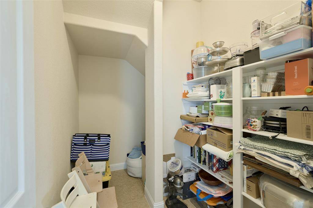 The family room features a cozy gas fireplace and easy access to the covered back patio and back yard.