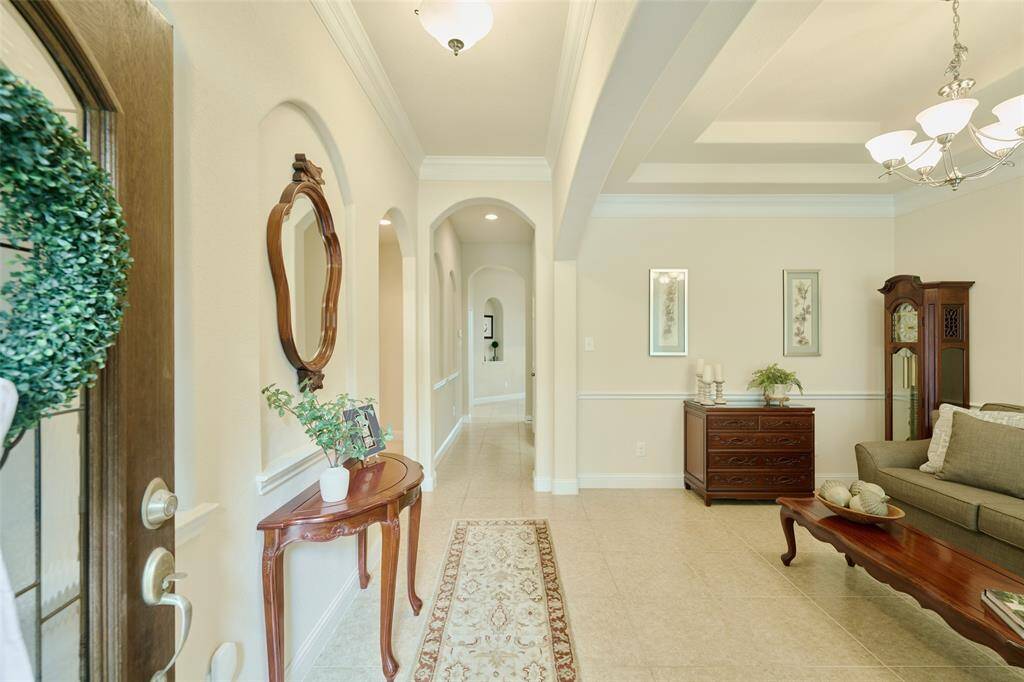 Welcoming entryway opens into a flexible front room....perfect for a formal dining room, formal living room, music room, library or additional study.