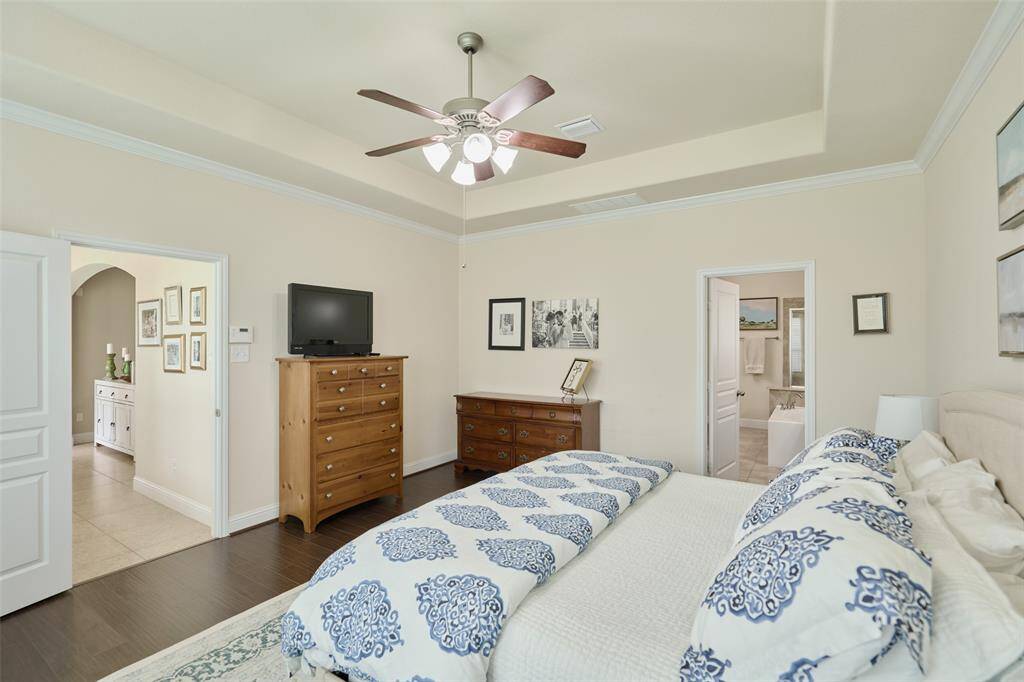 2nd bedroom suite downstairs in the back of the home overlooking the backyard