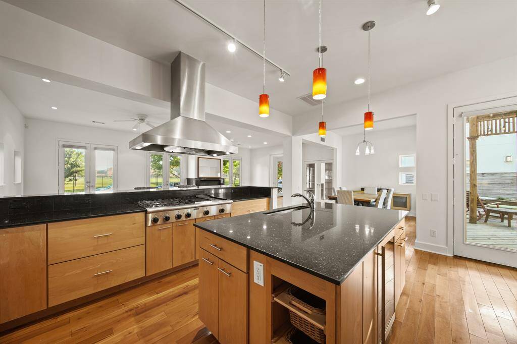 You will love the pendent and recessed lighting, granite counters thorough out, plenty of cabinets for storage.