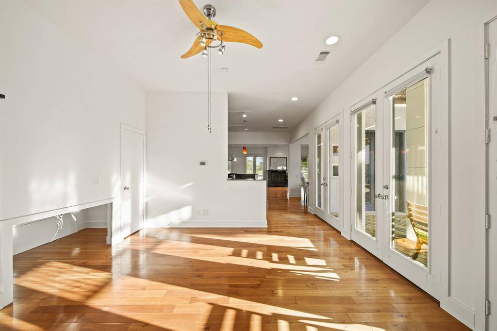 Flex space with beautiful natural light, wood floors, fan and closet! This space is your blank canvas.