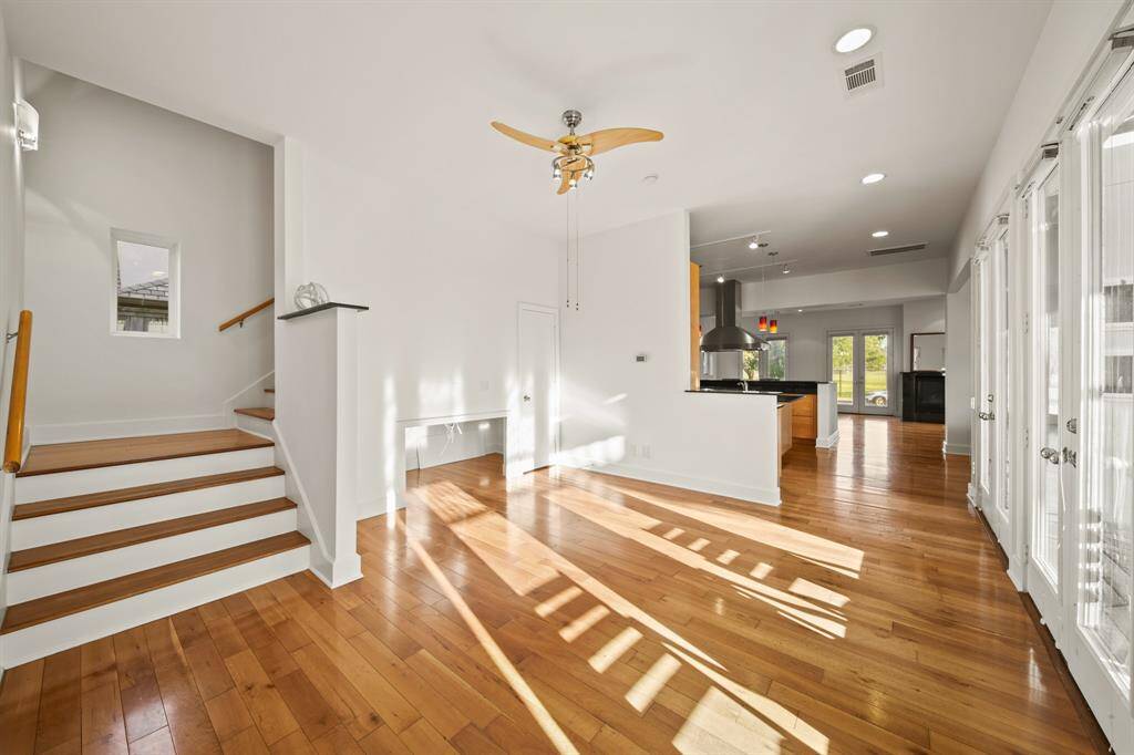 Stairs leading from the flex space to the second floor.