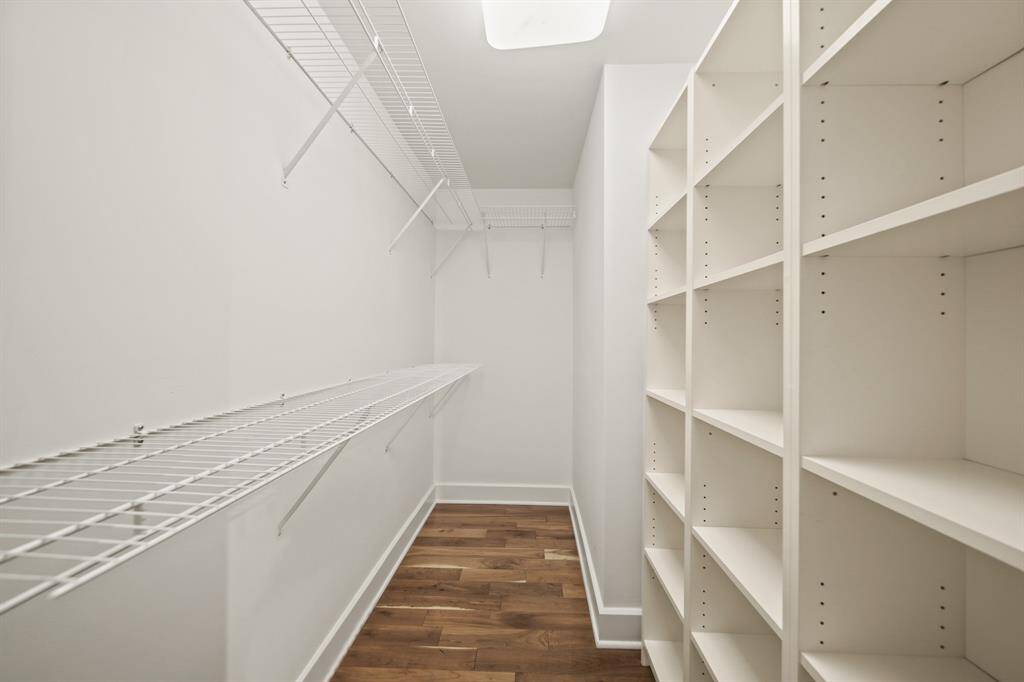 Primary closet built ins with storage.