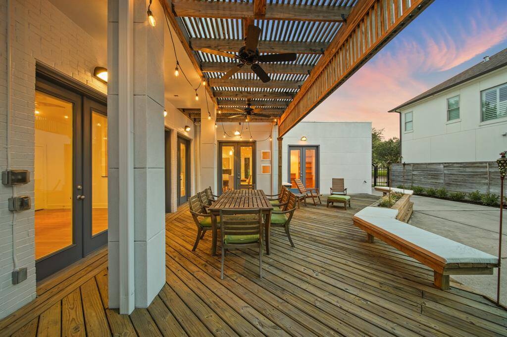 Covered back patio, new ceiling fans, lights, seating area - perfect for entertaining family and friends!