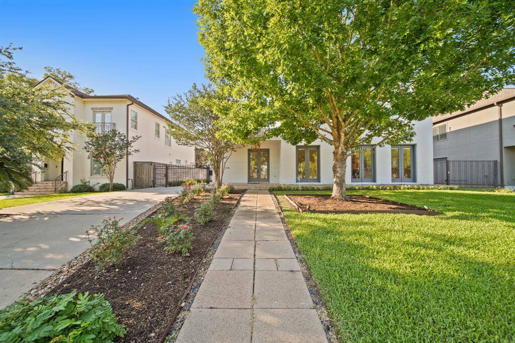 Inviting entrance to 3810 Bellefontaine St. Recently painted exterior. French doors throughout first floor.