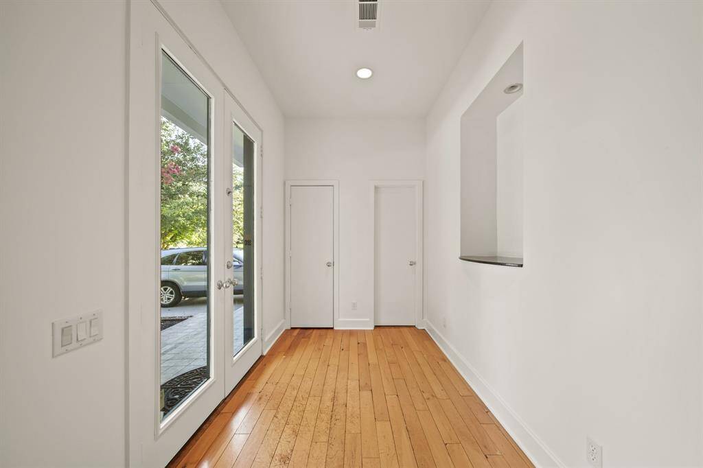 Frendh doors welcome you into the foyer with wood floors. New paint interior througout.