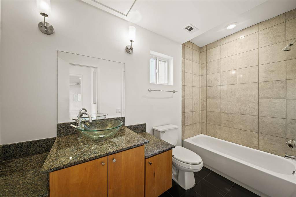 Full bathroom with granite countertops. Dual access to this bathroom from foyer and bedroom/study/flex room.