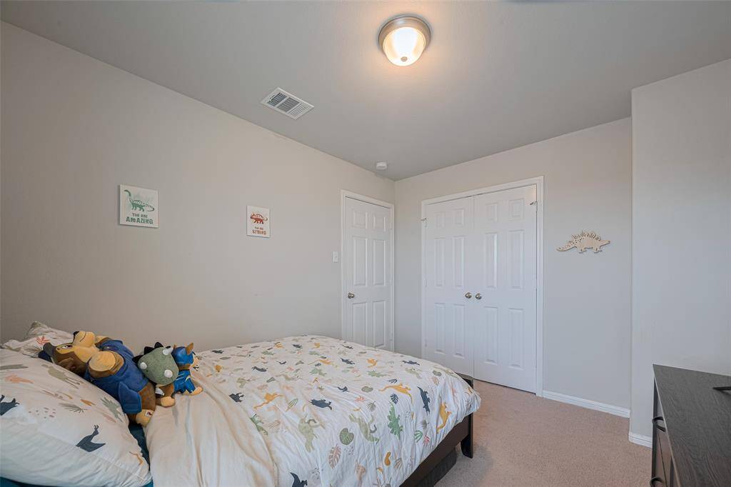 Highlighting both the closet and entry door, this photo reveals how the room is designed with ease of use in mind.